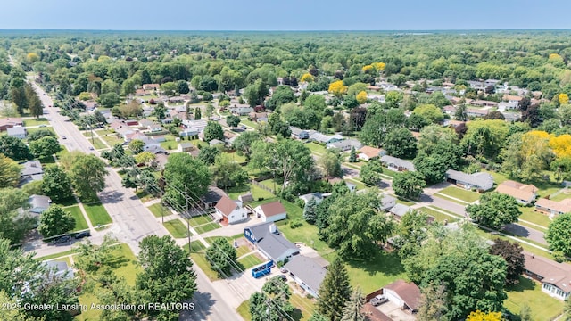 3326 W Willow St, Lansing, MI 48917 - aerial view of property and surrounding area featuring nearby suburban area and a forest