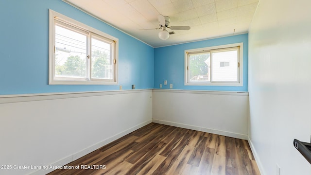 3326 W Willow St, Lansing, MI 48917 - empty room with plenty of natural light, dark wood finished floors, baseboards, and ceiling fan