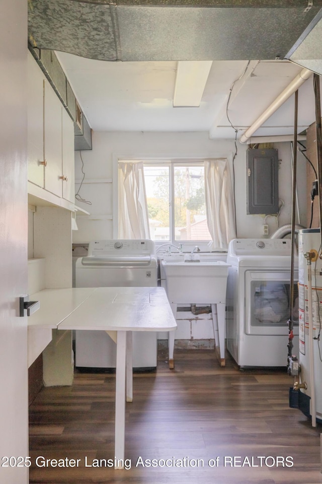 3326 W Willow St, Lansing, MI 48917 - laundry room featuring electric panel, wood finished floors, cabinet space, and gas water heater