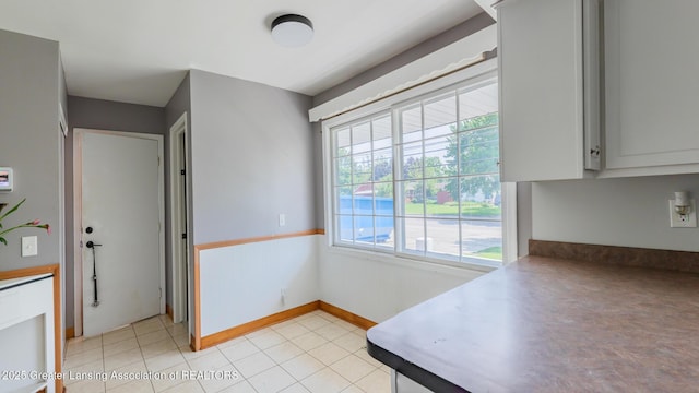 3326 W Willow St, Lansing, MI 48917 - dining space with light tile patterned floors
