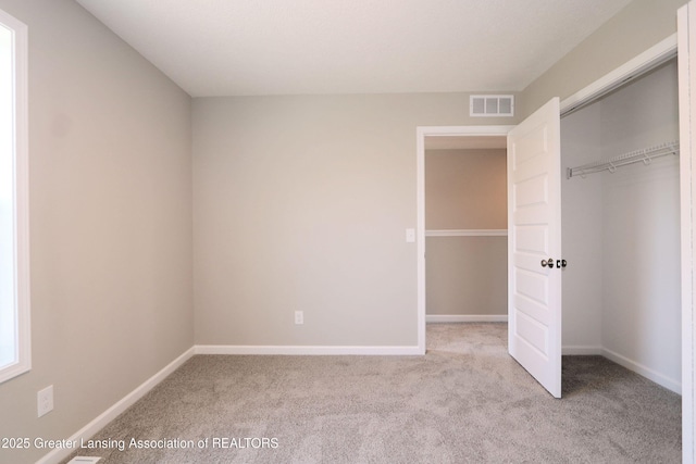 605 Landbridge, Perry, MI 48872 - unfurnished bedroom featuring carpet flooring and a closet