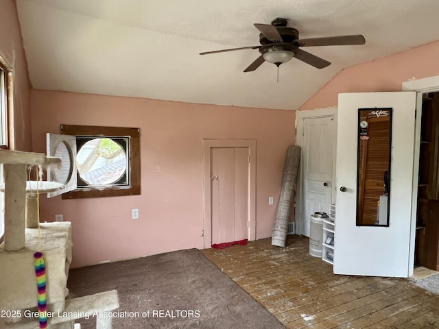 125 N E St, Mason, MI 48854 - unfurnished living room with a ceiling fan and vaulted ceiling
