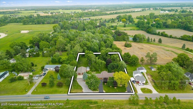 1055 Hull Rd, Mason, MI 48854 - aerial view of sparsely populated area with property boundaries highlighted and a tree filled landscape