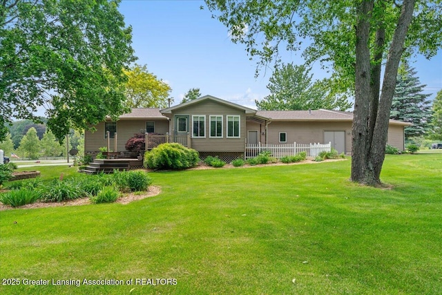 1055 Hull Rd, Mason, MI 48854 - rear view of property with a deck and a yard