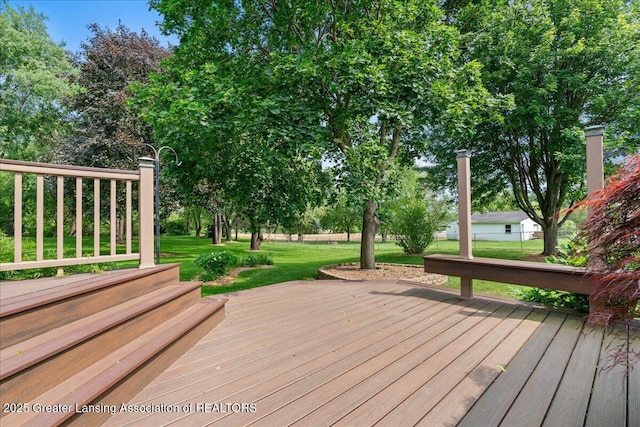 1055 Hull Rd, Mason, MI 48854 - wooden terrace featuring a lawn