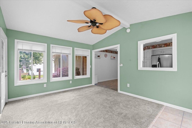 1055 Hull Rd, Mason, MI 48854 - carpeted spare room with a ceiling fan, lofted ceiling, and baseboards