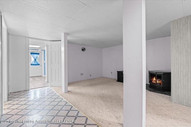 1055 Hull Rd, Mason, MI 48854 - basement with light carpet and a paneled ceiling