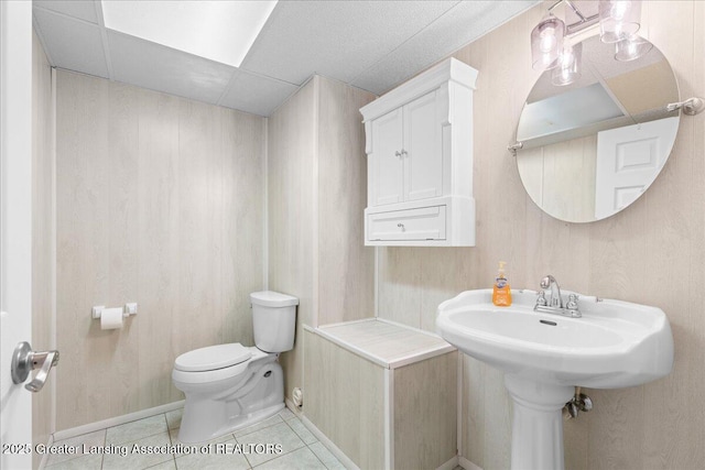 1055 Hull Rd, Mason, MI 48854 - half bath with toilet and tile patterned flooring