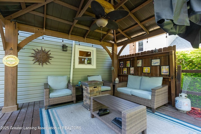 826 Clyde St, Lansing, MI 48915 - wooden terrace featuring a gazebo, an outdoor hangout area, and a ceiling fan