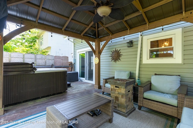 826 Clyde St, Lansing, MI 48915 - wooden terrace with a gazebo, a hot tub, and ceiling fan