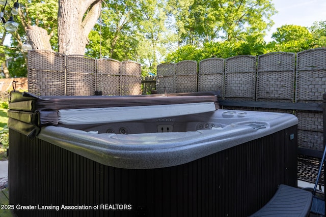 826 Clyde St, Lansing, MI 48915 - wooden terrace with a hot tub