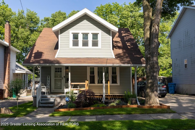 826 Clyde St, Lansing, MI 48915 - view of front facade featuring covered porch