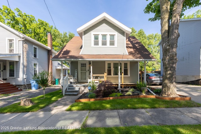826 Clyde St, Lansing, MI 48915 - view of front of home featuring a porch