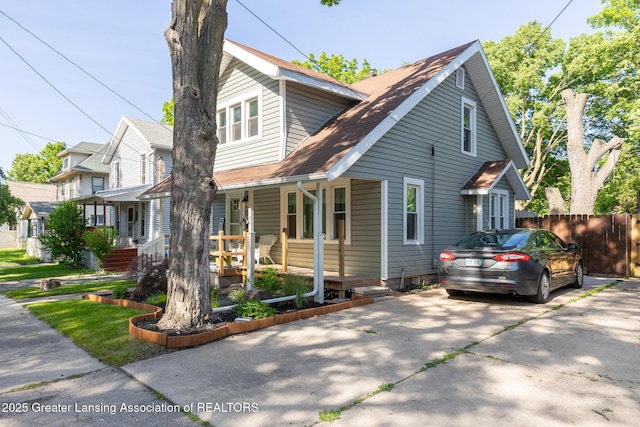 826 Clyde St, Lansing, MI 48915 - view of front of property with a porch and driveway