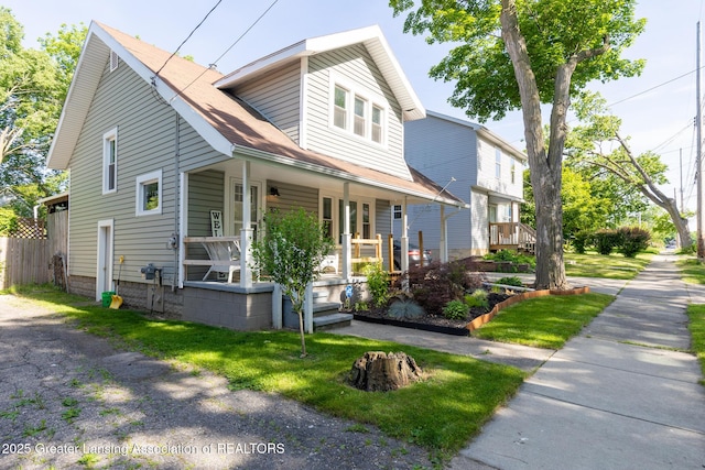 826 Clyde St, Lansing, MI 48915 - view of front of property with a porch