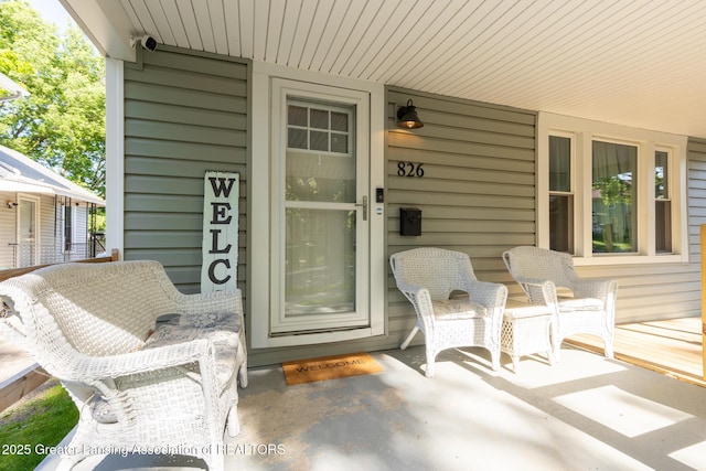 826 Clyde St, Lansing, MI 48915 - property entrance featuring a porch and a surveillance system