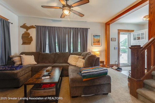 826 Clyde St, Lansing, MI 48915 - living room featuring stairway, ceiling fan, and carpet