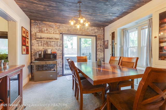 826 Clyde St, Lansing, MI 48915 - carpeted dining room featuring wooden ceiling, plenty of natural light, wine cooler, a chandelier, and baseboards