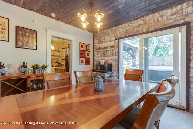 826 Clyde St, Lansing, MI 48915 - dining room with a chandelier and wood ceiling