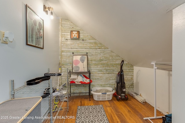 826 Clyde St, Lansing, MI 48915 - interior space featuring wooden walls, wood finished floors, and lofted ceiling
