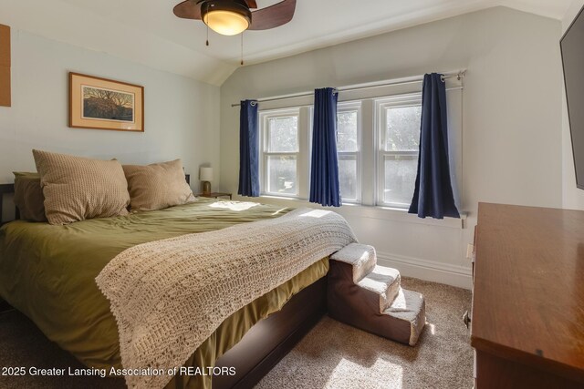 826 Clyde St, Lansing, MI 48915 - carpeted bedroom featuring vaulted ceiling, ceiling fan, and baseboards
