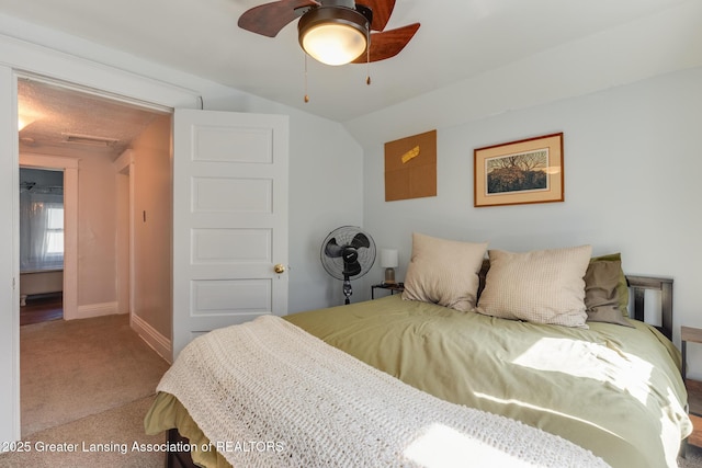 826 Clyde St, Lansing, MI 48915 - bedroom featuring carpet flooring, baseboards, lofted ceiling, and ceiling fan