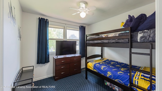 120 Chanticleer Trl, Lansing, MI 48917 - bedroom with dark colored carpet, baseboards, and ceiling fan