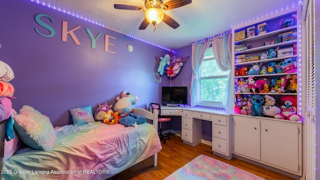 120 Chanticleer Trl, Lansing, MI 48917 - bedroom with light wood-type flooring, a desk, and a ceiling fan