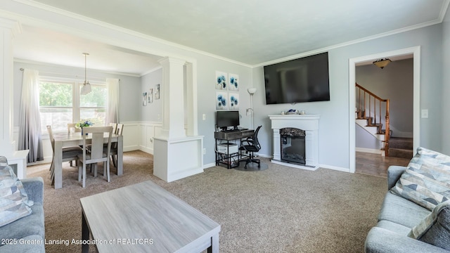 120 Chanticleer Trl, Lansing, MI 48917 - carpeted living room featuring decorative columns, ornamental molding, stairway, and a glass covered fireplace