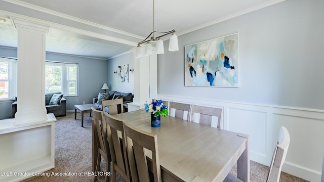 120 Chanticleer Trl, Lansing, MI 48917 - dining space featuring carpet floors, crown molding, decorative columns, a wainscoted wall, and a decorative wall