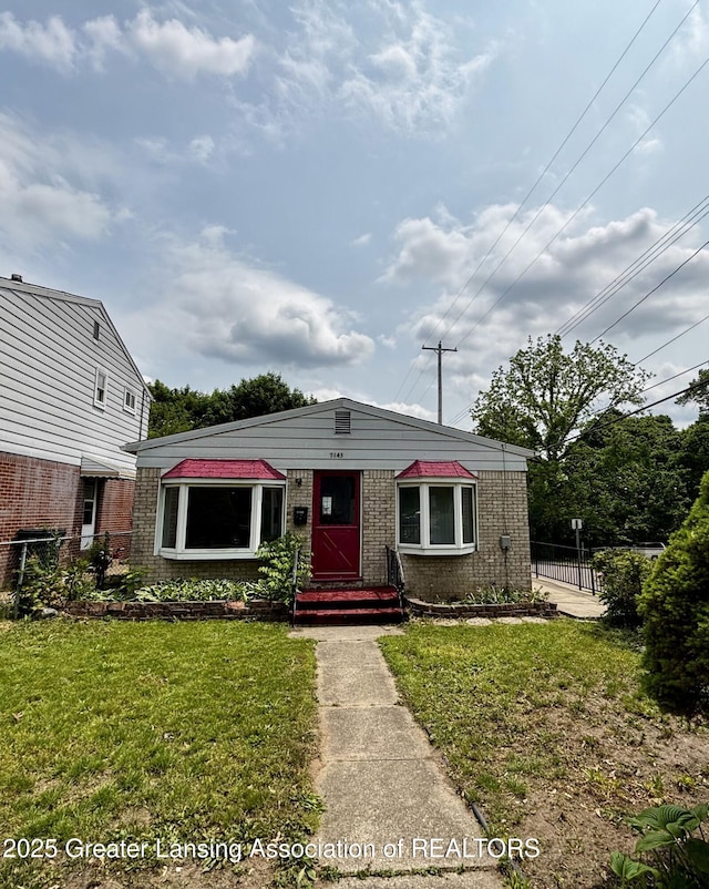 1143 Lathrop St, Lansing, MI 48912 - view of front of home featuring brick siding