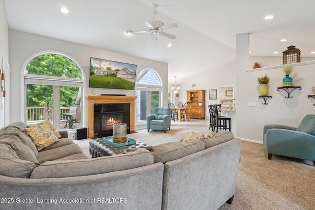 11782 Sara Ann Dr, Dewitt, MI 48820 - living room featuring light colored carpet, ceiling fan, a glass covered fireplace, recessed lighting, and baseboards