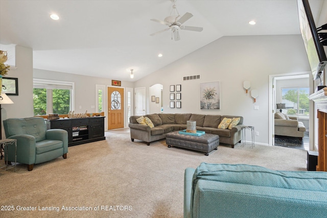 11782 Sara Ann Dr, Dewitt, MI 48820 - carpeted living area featuring arched walkways, recessed lighting, a ceiling fan, and high vaulted ceiling