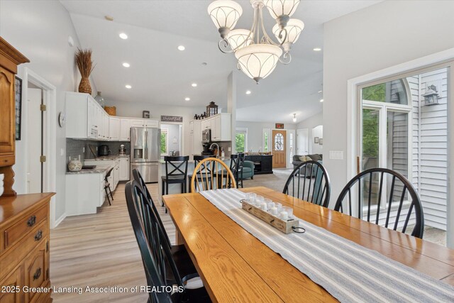 11782 Sara Ann Dr, Dewitt, MI 48820 - dining area featuring recessed lighting, a chandelier, and light wood-style floors