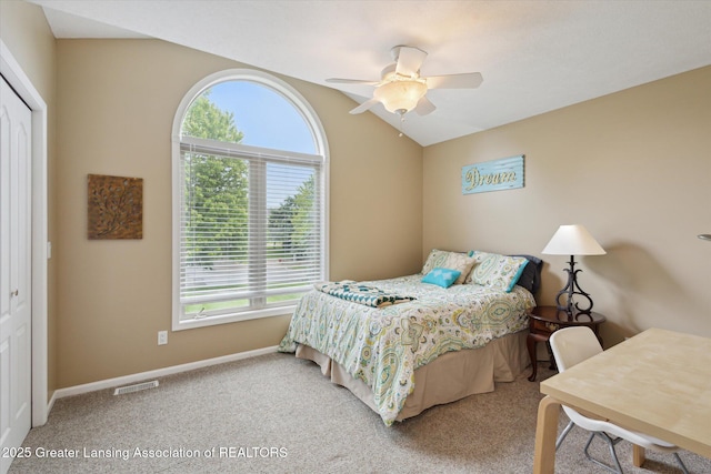 11782 Sara Ann Dr, Dewitt, MI 48820 - carpeted bedroom featuring baseboards, a closet, ceiling fan, and lofted ceiling