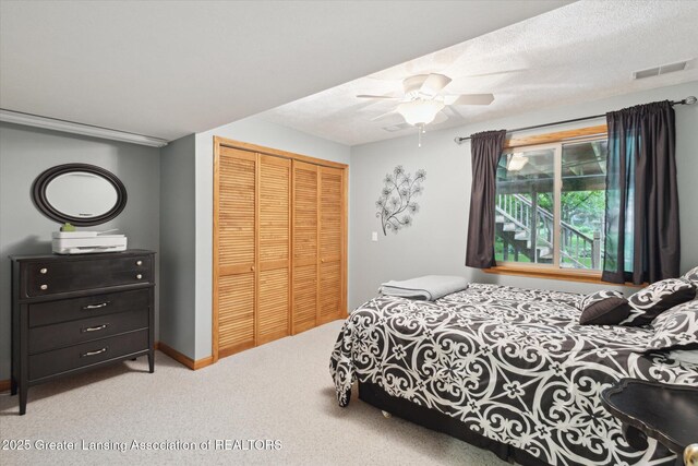 11782 Sara Ann Dr, Dewitt, MI 48820 - bedroom with a closet, carpet floors, and a ceiling fan