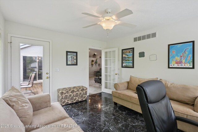 11782 Sara Ann Dr, Dewitt, MI 48820 - living area featuring french doors, a ceiling fan, and baseboards