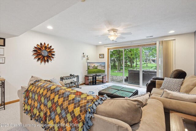 11782 Sara Ann Dr, Dewitt, MI 48820 - carpeted living room with baseboards, recessed lighting, and ceiling fan