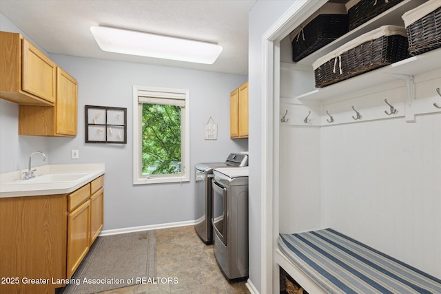 11782 Sara Ann Dr, Dewitt, MI 48820 - washroom with cabinet space, independent washer and dryer, and baseboards