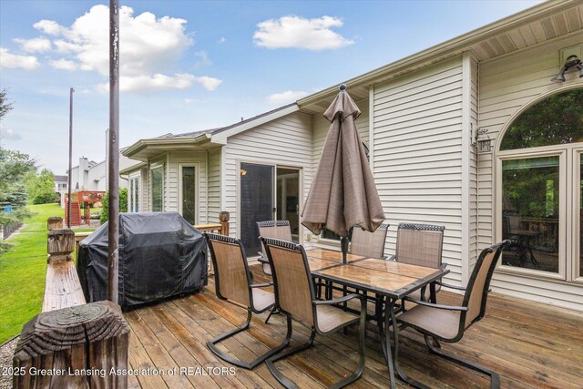 11782 Sara Ann Dr, Dewitt, MI 48820 - wooden deck with outdoor dining area and grilling area