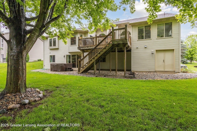 11782 Sara Ann Dr, Dewitt, MI 48820 - back of property featuring a hot tub, a deck, stairway, and a yard