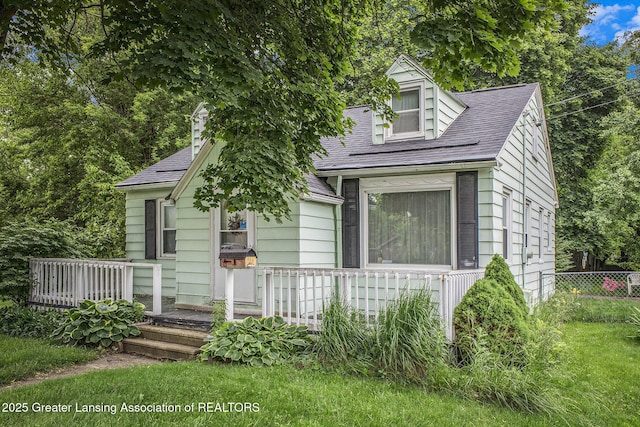 4434 Holt Rd, Holt, MI 48842 - view of front of house with a wooden deck and roof with shingles