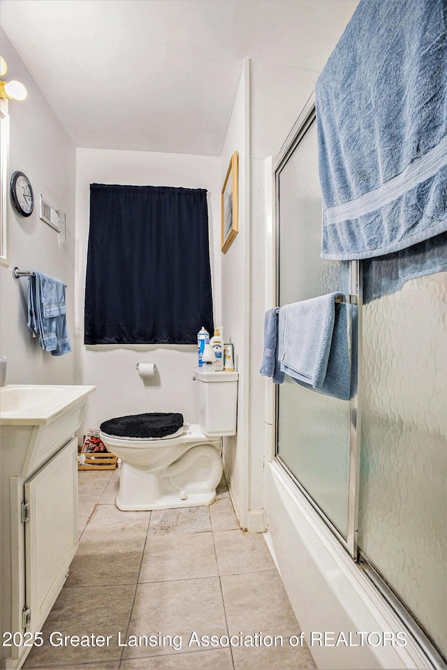 4434 Holt Rd, Holt, MI 48842 - bathroom featuring vanity, tile patterned flooring, and bath / shower combo with glass door