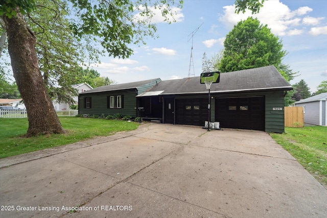 925 Summit St, Owosso, MI 48867 - view of front of home with a garage and driveway