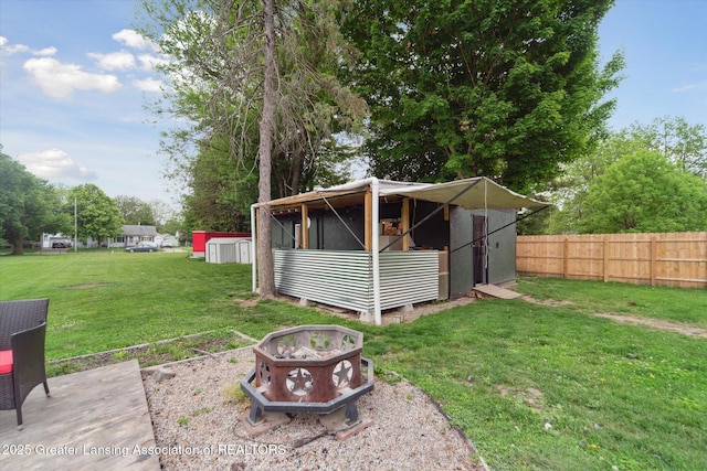 925 Summit St, Owosso, MI 48867 - view of shed with an outdoor fire pit