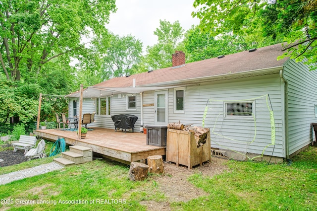 5013 Algonquin Way, Okemos, MI 48864 - rear view of house featuring a chimney and a wooden deck