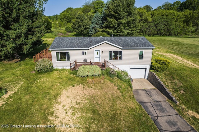 1200 S Michigan Rd, Eaton Rapids, MI 48827 - view of front of property with driveway, a garage, a front yard, stairway, and a shingled roof