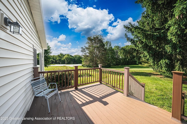 1200 S Michigan Rd, Eaton Rapids, MI 48827 - wooden deck featuring a yard and view of wooded area