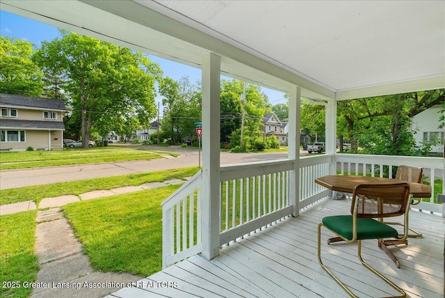 1128 Hickory St, Lansing, MI 48912 - porch featuring a yard and a residential view