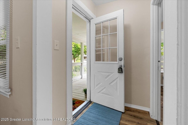 1128 Hickory St, Lansing, MI 48912 - entrance foyer featuring wood finished floors and baseboards